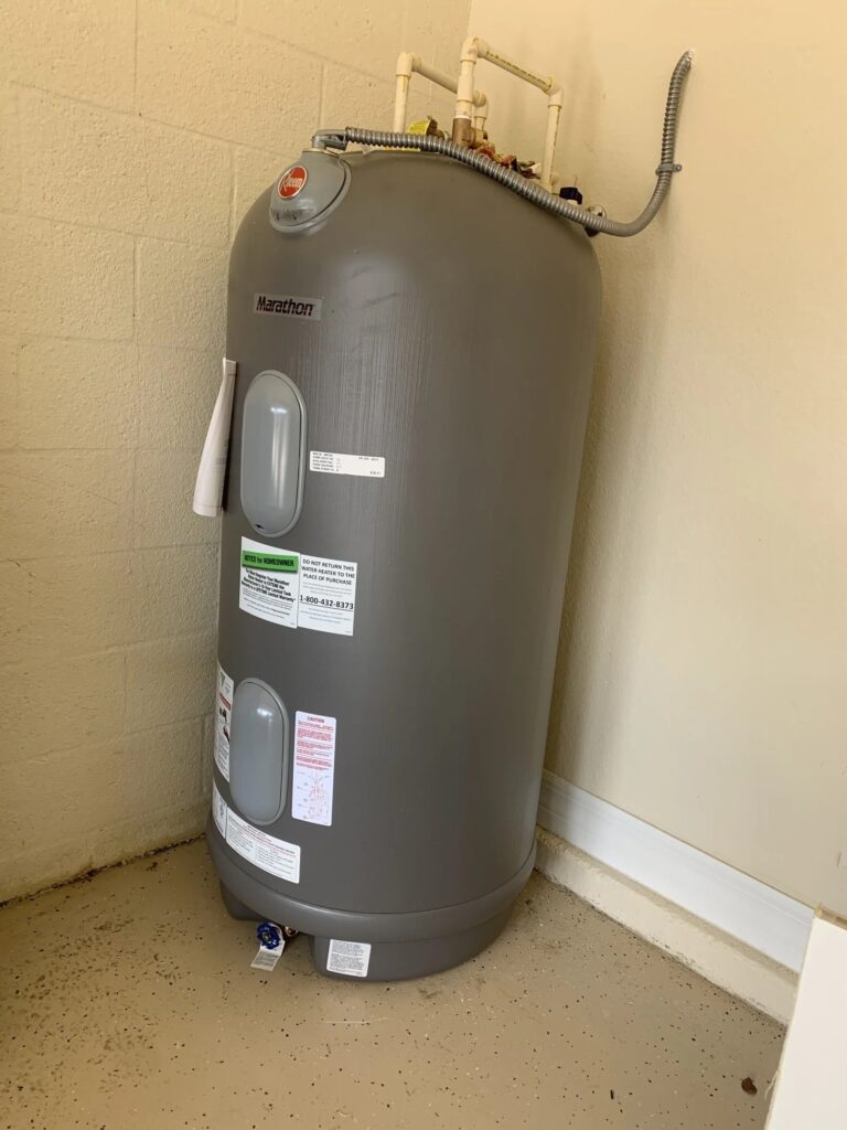 New 70 gallon gas Rheem Marathon water heater with a lifetime leak warranty installed at a commercial location to improve efficiency and increase energy savings